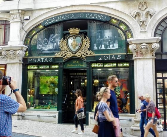 Lisbon Tour man taking a picture to a window